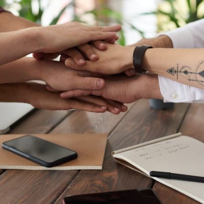pexels-fauxels-3184431 Image of hands coming in to signify working together.