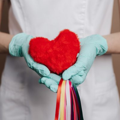 pexels-karolina-grabowska-4046971 Hands holding heart signifying care and compassion.
